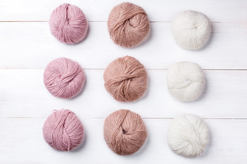 Wool skeins of thread on white boards. a ball of thread from the Italian angora. knitting
