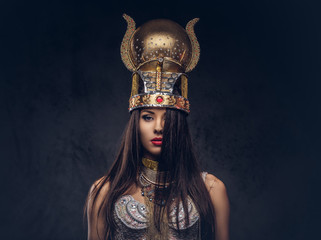 Portrait of haughty Egyptian queen in an ancient pharaoh costume.