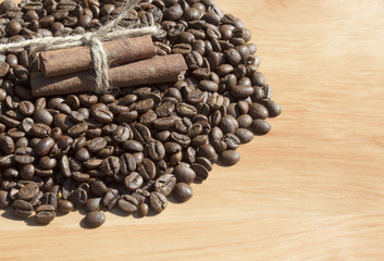 cinnamon stick on coffee beans in the sun