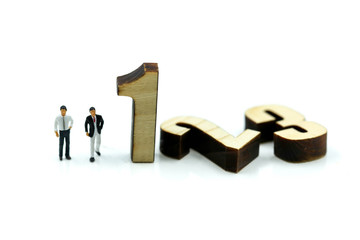 Miniature people : Businessman and team with wooden number of 1,2,3 , to be the first,business competition concept.