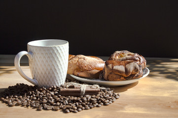 still life of coffee breakfast with brioches on a wooden background