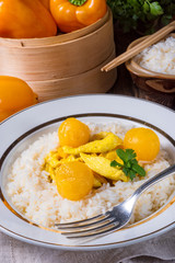 Chicken strips with rice and sweet mirabelle in curry sauce
