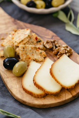 Cheese board with olives and walnut.