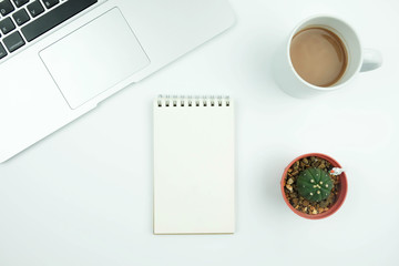 Creative flat lay design of workspace desk with laptop, notebook , cactus and coffee.