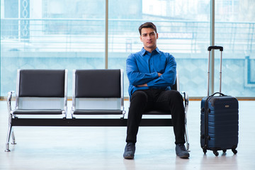 Man wairing to boarding in airport lounge room