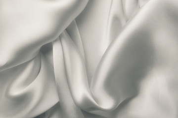 Fototapeta na wymiar Elegant white satin silk with waves, abstract background