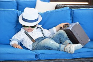 Little traveler relaxing in a lounge