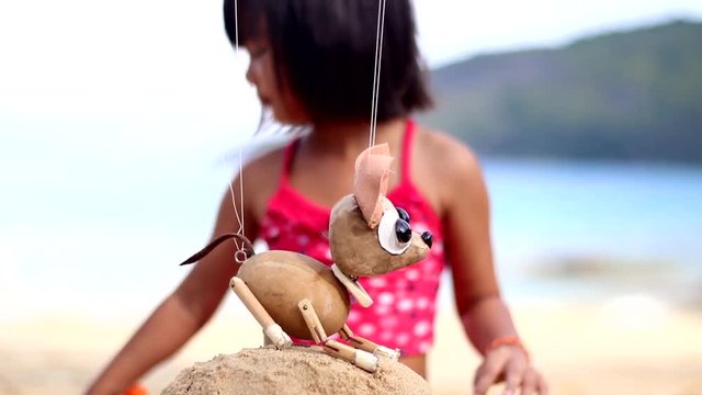 scene of girl and little chihuahua puppet
