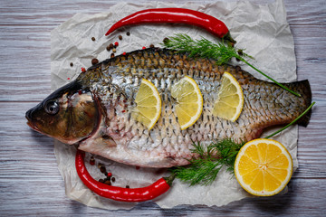Carp fish with fresh vegetables