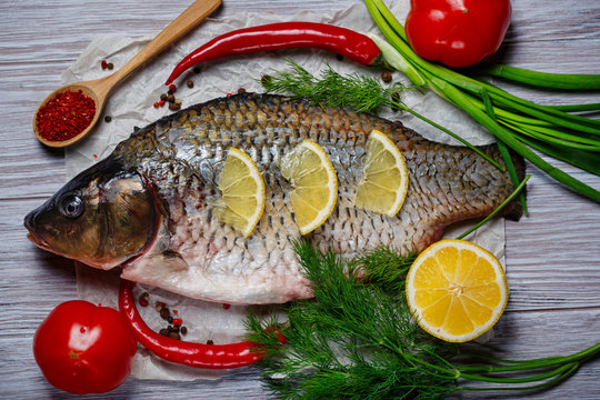 Carp fish with fresh vegetables