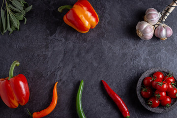 colorful vegetable flatlay on dark surface