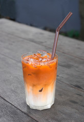 Iced tea on wooden table.
