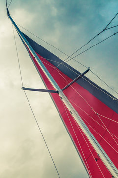 yacht with red sails in the sea