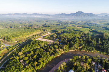 Obraz premium Aerial view rural village with river green tree in morning