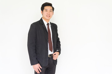 Obraz na płótnie Canvas Happy asian young handsome businessman isolated over white background.