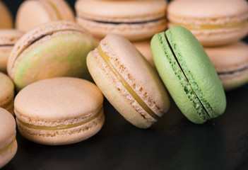Many colored sweet macaroons cookie. Can be used as a background. Selective focus