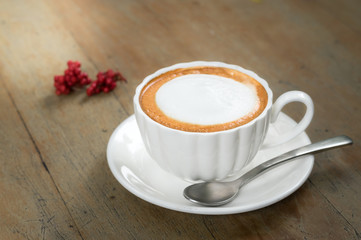 Hot coffee in white cup.