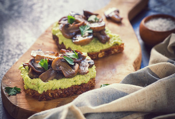 Toast with avocado and grilled mushroom