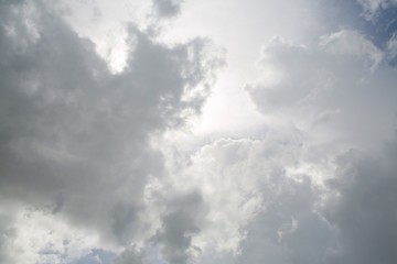 Fototapeta premium Fluffy Billowy Cumulus Clouds in the Blue Summer Sky Backlit by the Sun in Florida