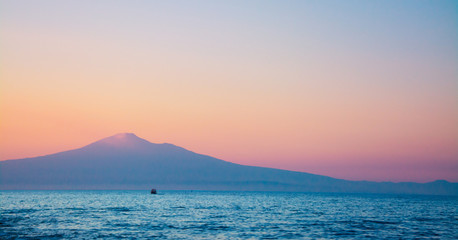 Naklejka na ściany i meble Etna Volcano in sunset sky