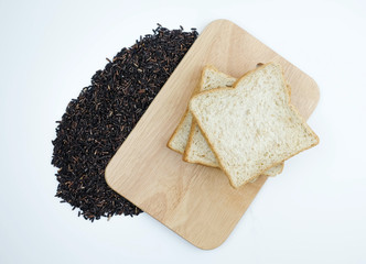 Top view of organic rice berry and whole wheat on wooden on white background, Healthy concept.