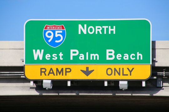 I-95 North West Palm Beach Ramp Only Sign on Overpass in Afternoon Sun