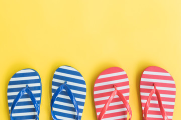 Flip flops on a yellow background