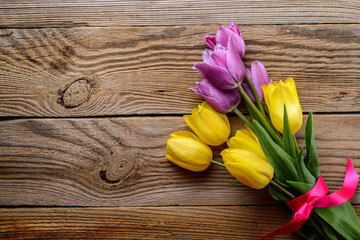 Fresh pink and yellow tulips. Spring floral  background