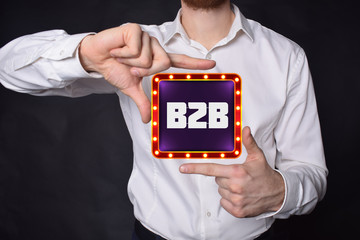 A businessman shows an inscription:B2B