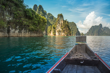 Fototapeta premium the tourist travel to lake by boat