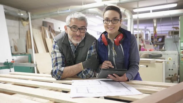 Wood industry technicians working together on project