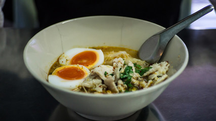 Spicy TOM YAM Pork noodle soup with Egg Boiled Thailand Travel Concept