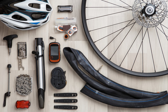 Picture of bicycle objects on wooden background.
