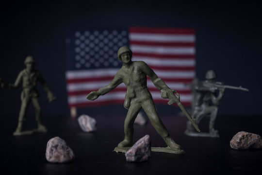 Toy soldiers in front of an American flag