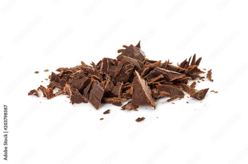 Wall mural Chocolate shavings of bitter chocolate isolated on white