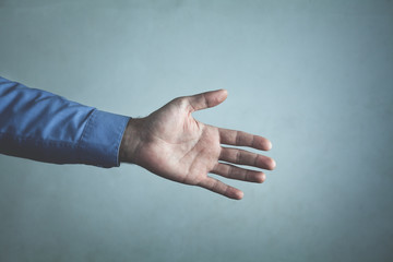 Obraz na płótnie Canvas Businessman offering hand for handshake. Deal concept
