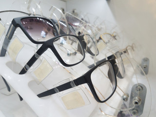 Eyeglasses, shades and sunglasses in optician's shop