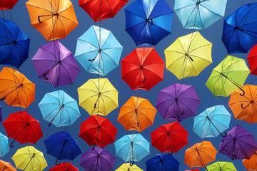 Fototapeta na wymiar Colorful umbrellas background in the sky. Street decoration.