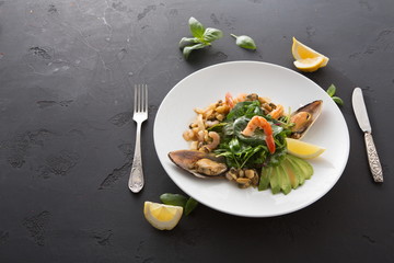 Warm salad with grilled seafood flat lay