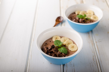 Chocolate pudding, banana and herbs in