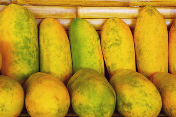 a lot of papayas in the market.