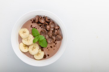 Chocolate pudding, banana and herbs in