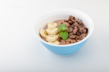 Chocolate pudding, banana and herbs in