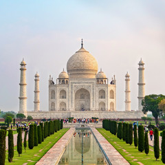 Taj Mahal front view reflected on the reflection pool, an ivory-white marble mausoleum on the south bank of the Yamuna river in Agra, Uttar Pradesh, India. One of the seven wonders of the world.