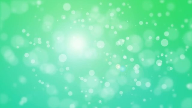 Green blue teal bokeh background with floating light particles.