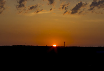 Naklejka premium late evening. The sun had almost stopped. The sky was written in the evening. On each side of the forest