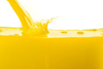 orange juice splashing against white background