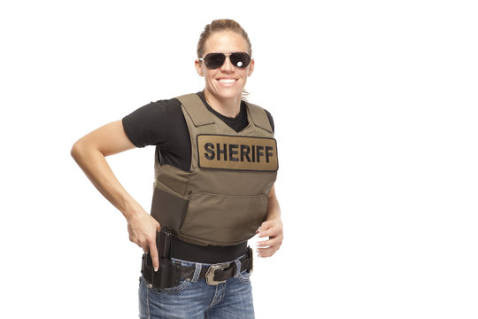 Happy policewoman wearing sunglasses