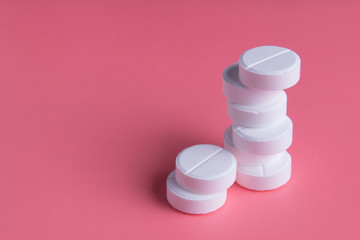 white pills on a pink background, medicine