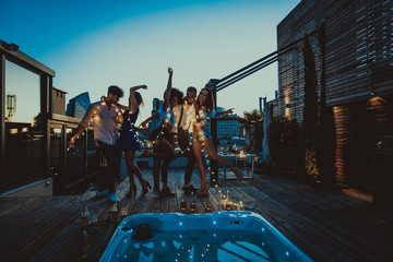 Friends partying on a rooftop